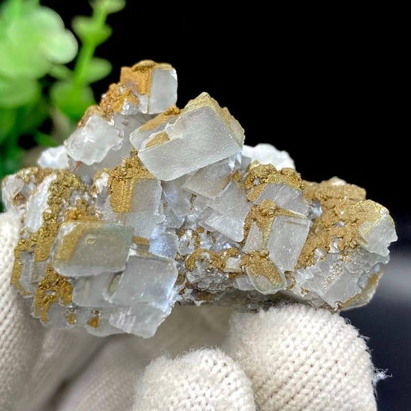 Pale pyramid calcite points with rusty pyrite film from Hunan, China, view 6 of 9