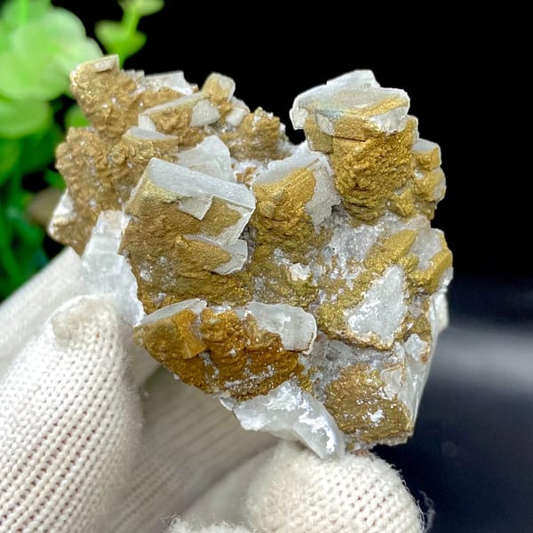 Pale pyramid calcite points with rusty pyrite film from Hunan, China, view 8 of 9