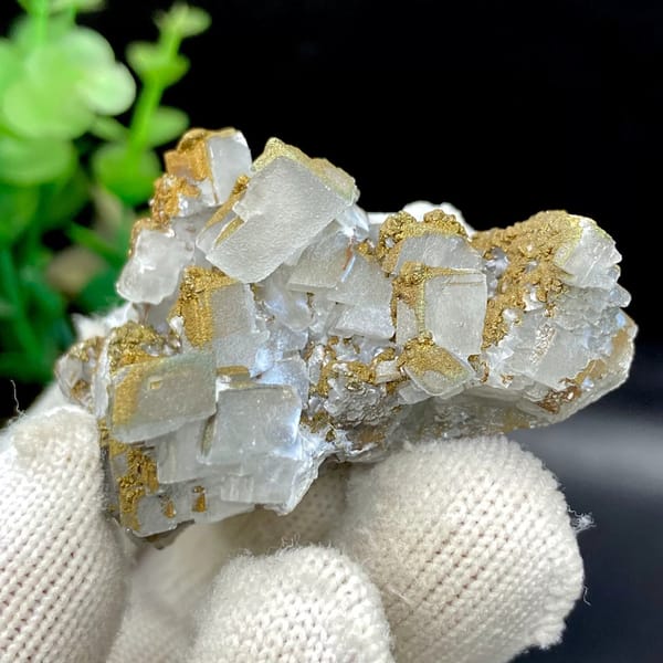 Pale pyramid calcite points with rusty pyrite film from Hunan, China, view 9 of 9