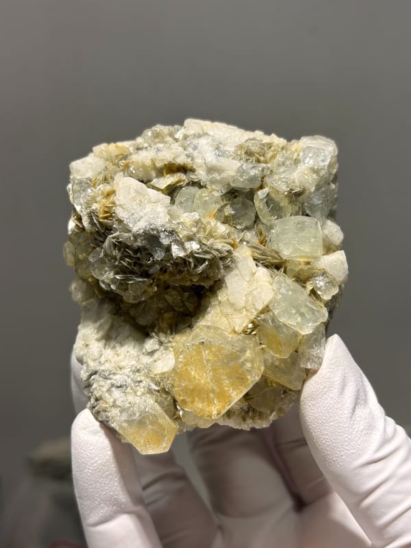 Pale yellow aquamarine crystals on mica and feldspar from Xuebaoding, Sichuan, China, second angle