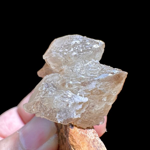 Large peach cerussite crystal on brown matrix from Morocco, view 3 of 6