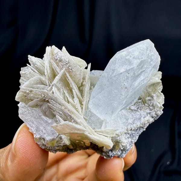 Pearly muscovite books with pale aquamarine crystal from Xuebaoding, Sichuan, China, view 2 of 6