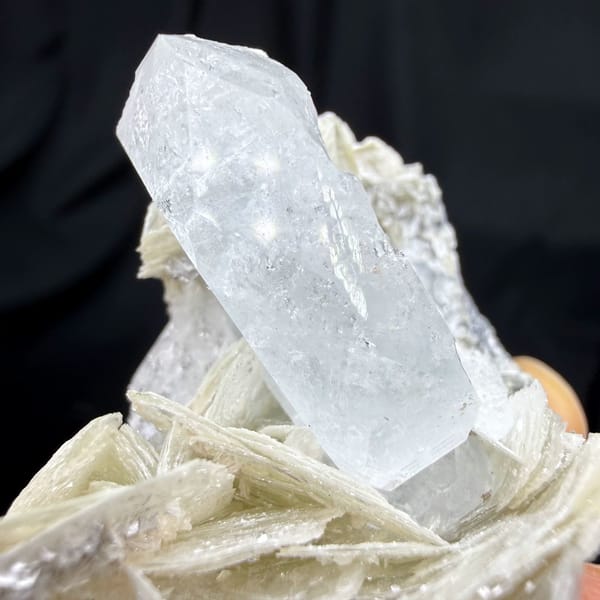 Pearly muscovite books with pale aquamarine crystal from Xuebaoding, Sichuan, China, view 4 of 6