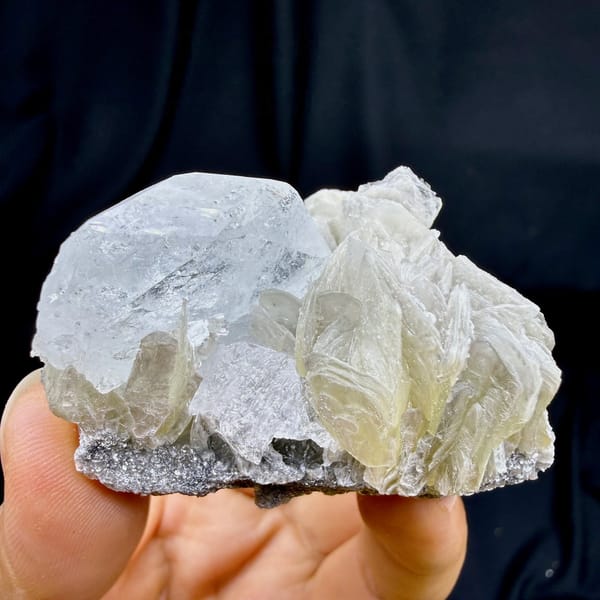Pearly muscovite books with pale aquamarine crystal from Xuebaoding, Sichuan, China, view 6 of 6