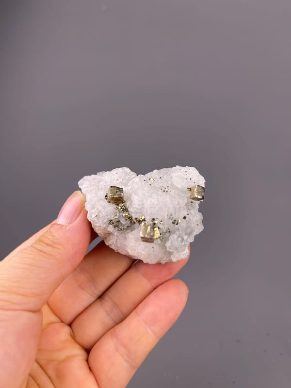 Petal-form Calcite specimen from Longyan, Fujian, China bearing white matrix with sharp pyrite cubes