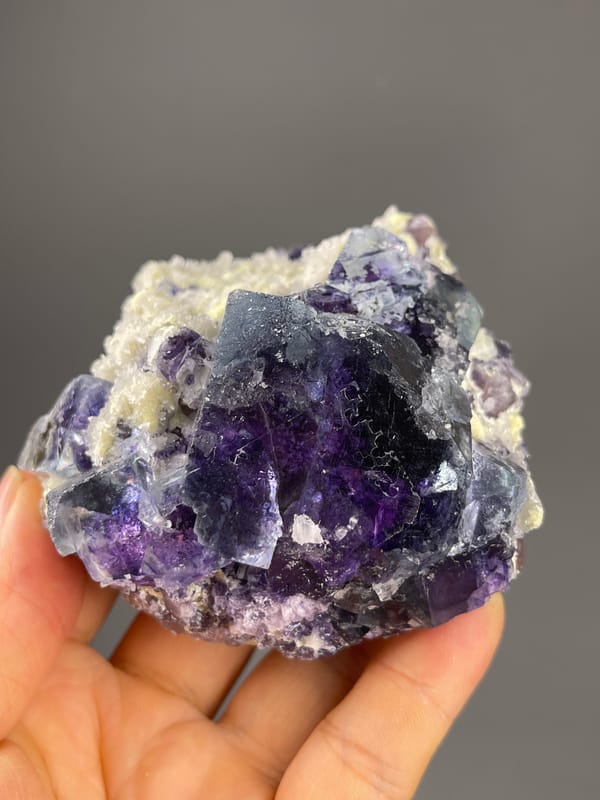 Phantom Fluorite specimen from Inner Mongolia, China showing purple cubes in cream matrix