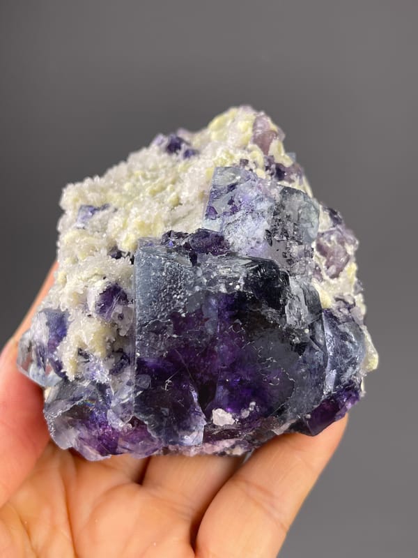 Phantom Fluorite specimen from Inner Mongolia, China, defined by purple cubes in cream matrix