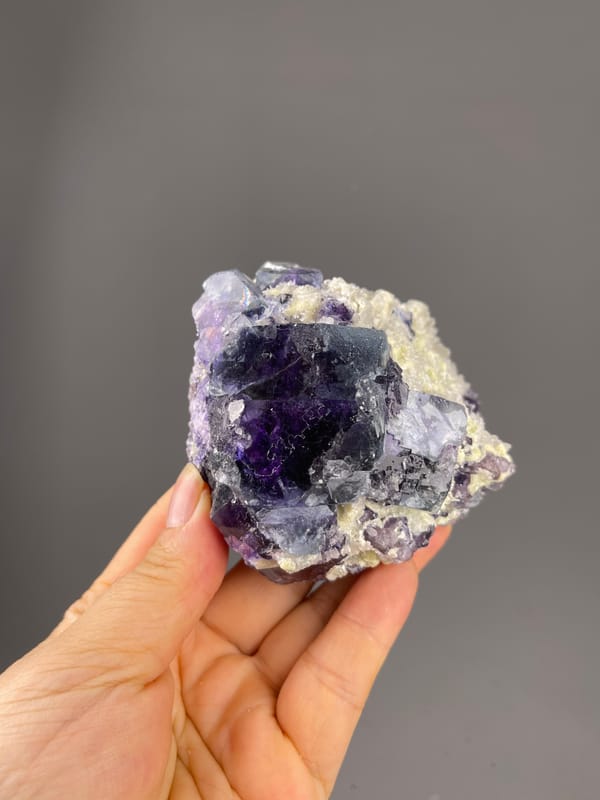 Purple cubes in cream matrix visible on phantom fluorite specimen from Inner Mongolia, China