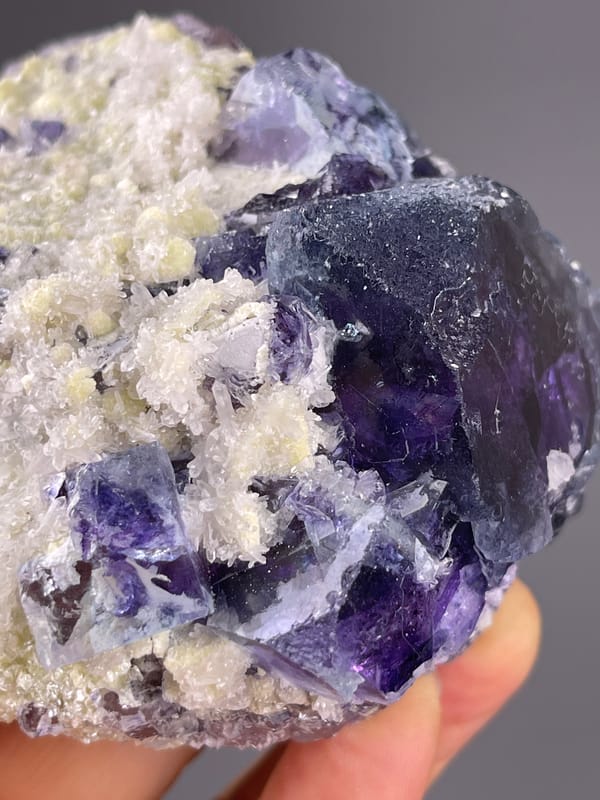 Phantom Fluorite specimen from Inner Mongolia, China displaying purple cubes in cream matrix