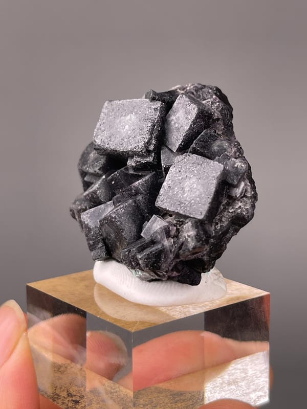 Lead-gray cubic crystal cluster visible on phantom fluorite specimen from Yindu, Chifeng, Inner Mongolia, China