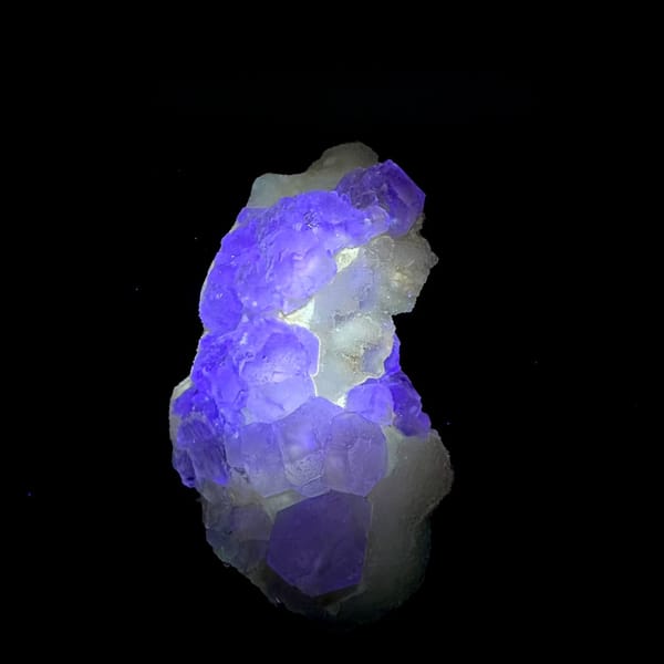 Pink-purple fluorite with quartz, from Jiangxi, China, front view in daylight, view 2 of 11