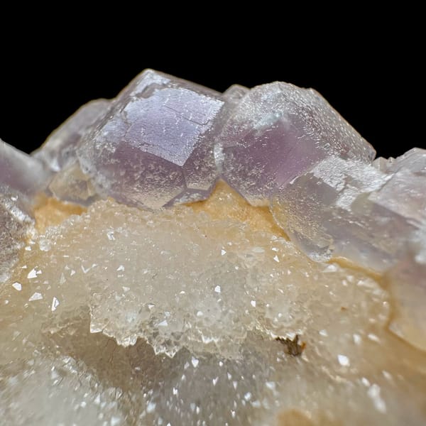 Pink-purple fluorite with quartz, from Jiangxi, China, front view in daylight, view 3 of 11