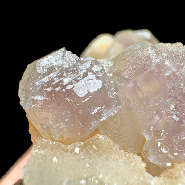 Pink-purple fluorite with quartz, from Jiangxi, China, front view in daylight, view 5 of 11