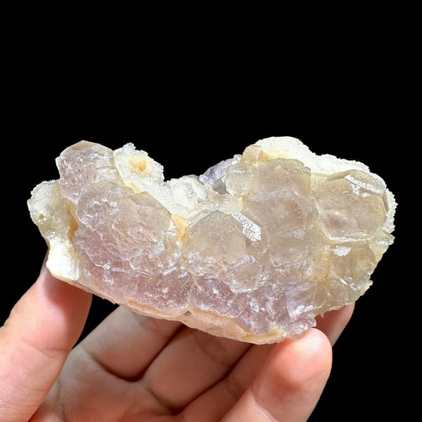 Pink-purple fluorite with quartz, from Jiangxi, China, front view in daylight, view 7 of 11