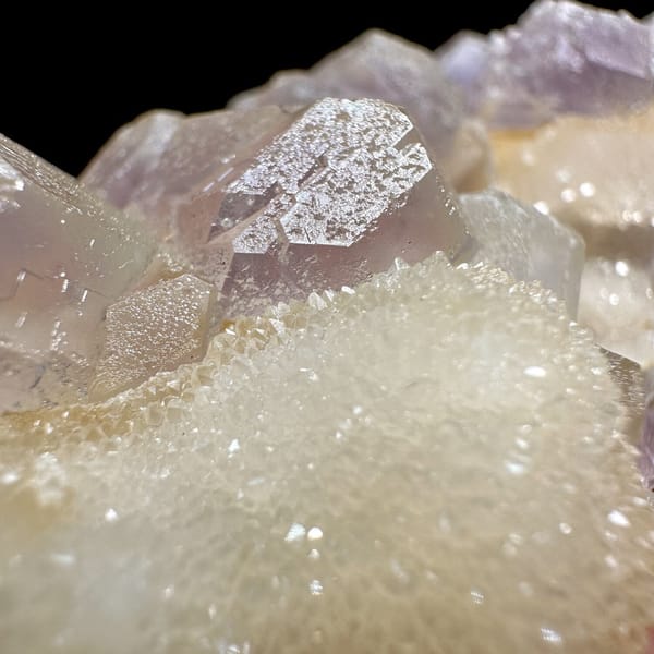 Pink-purple fluorite with quartz, from Jiangxi, China, front view in daylight, view 8 of 11