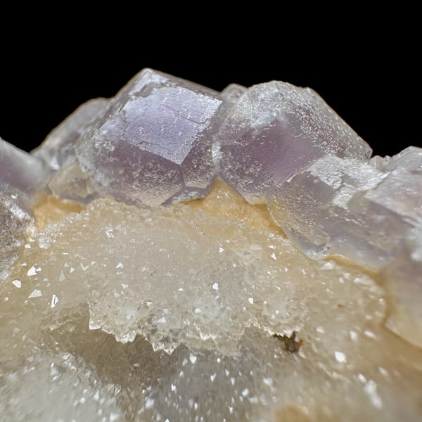 Pink-purple fluorite with quartz, from Jiangxi, China, front view in daylight, view 9 of 11