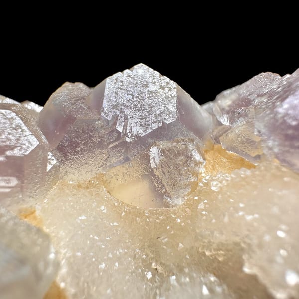 Pink-purple fluorite with quartz, from Jiangxi, China, front view in daylight, view 10 of 11