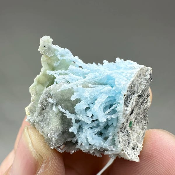 Pocket of sky-blue aragonite needles inside white druse from Yunnan, China, view 2 of 6