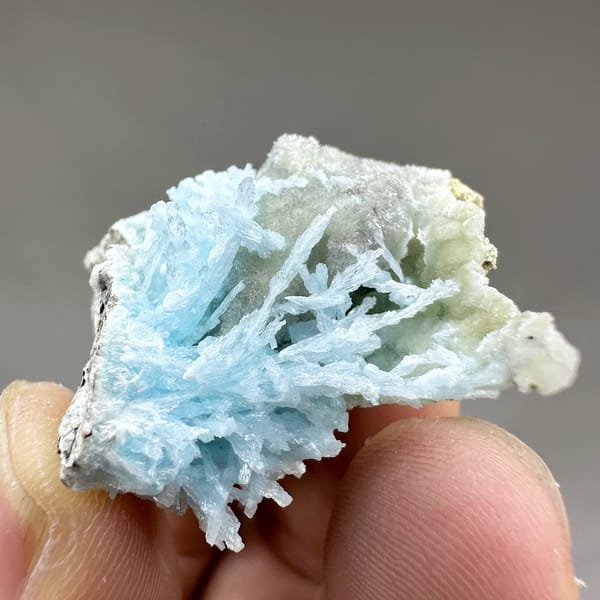 Pocket of sky-blue aragonite needles inside white druse from Yunnan, China, view 3 of 6