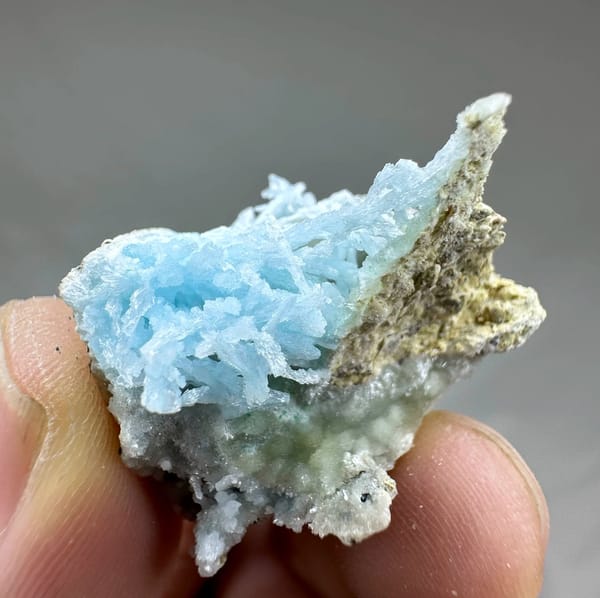 Pocket of sky-blue aragonite needles inside white druse from Yunnan, China, view 5 of 6