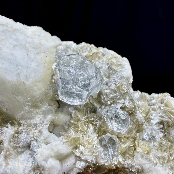 Short pale aquamarine prism on muscovite and feldspar from Xuebaoding, Sichuan, China, view 5 of 6
