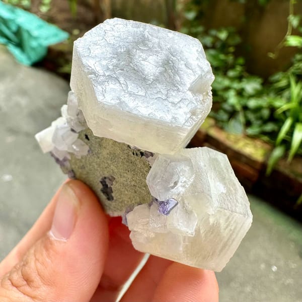 Prismatic calcite crystals, from Fujian, China, front view in daylight
