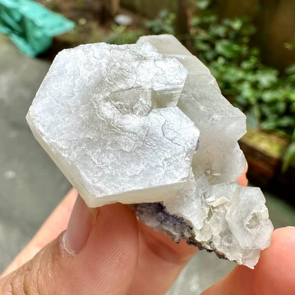 Prismatic calcite crystals, from Fujian, China, front view in daylight, view 3 of 12