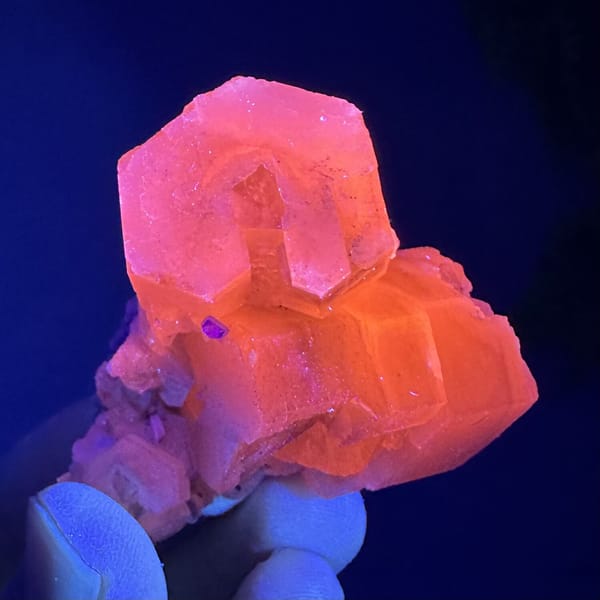 Prismatic calcite crystals, from Fujian, China, front view in daylight, view 7 of 12