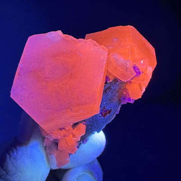Prismatic calcite crystals, from Fujian, China, front view in daylight, view 8 of 12