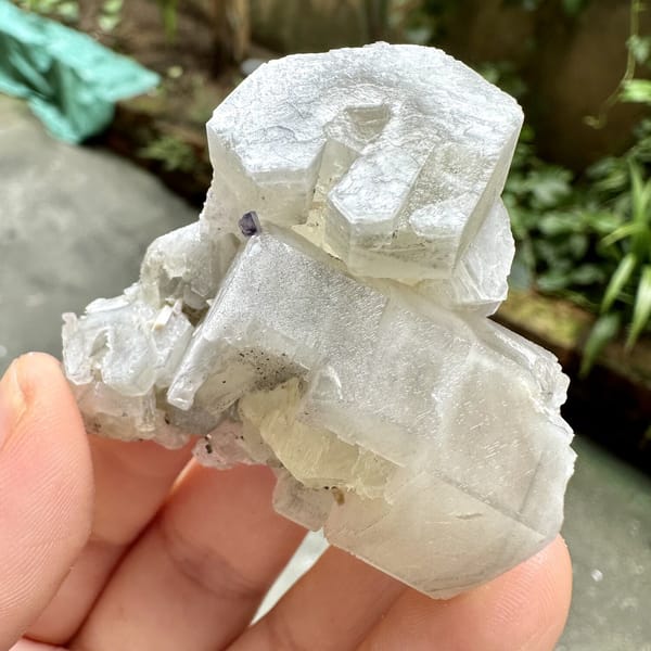 Prismatic calcite crystals, from Fujian, China, front view in daylight, view 11 of 12