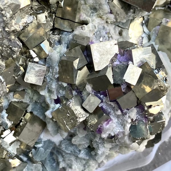 Large pyrite and green quartz display piece on stand from Shangbao, Hunan, China, close-up of the crystal faces