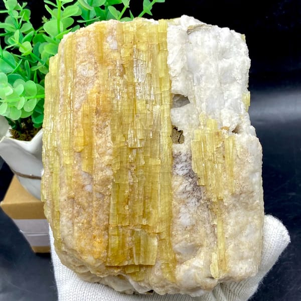 Block of golden topaz columns in white matrix from Germany, side view