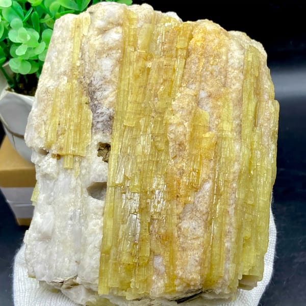 Block of golden topaz columns in white matrix from Germany, close-up of terminations