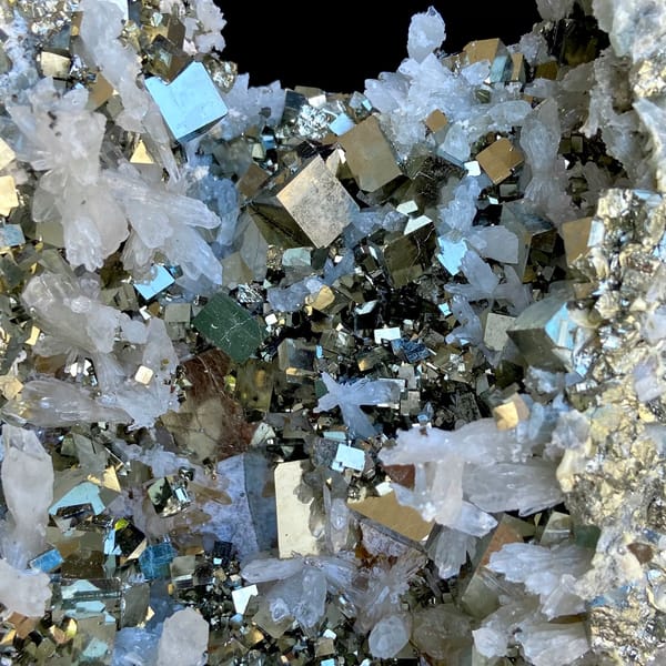 Large pyrite and quartz plate on stand from Shangbao, Hunan, China, close-up of the crystal faces