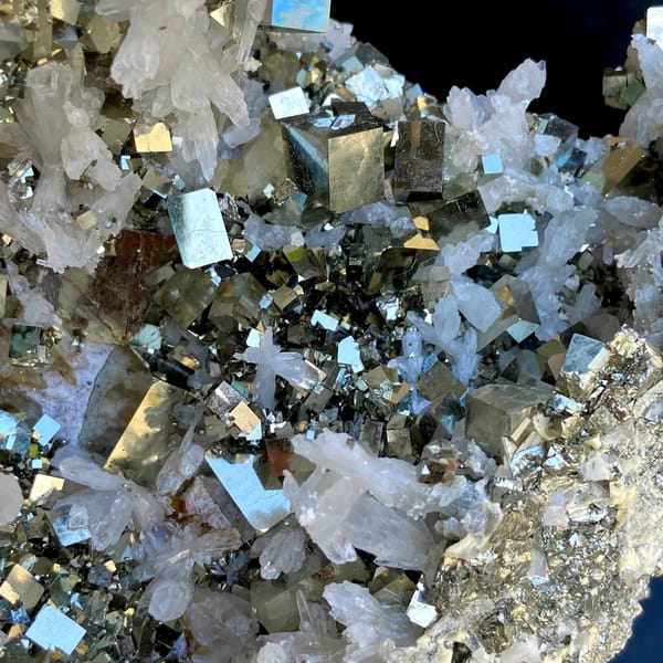 Large pyrite and quartz plate on stand from Shangbao, Hunan, China, detail of the matrix contact