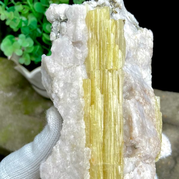 Block of golden prismatic topaz columns in white matrix from Germany, detail of the matrix contact