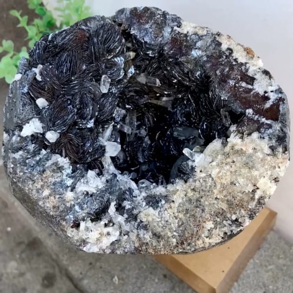 Pyrite and quartz geode bowl from Guangdong, China, on stand
