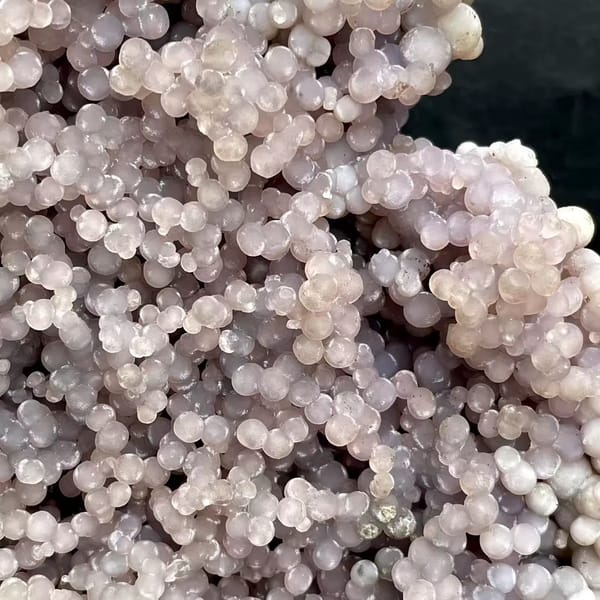 Tall tower of pearly lavender grape agate on stand from Indonesia, overall view