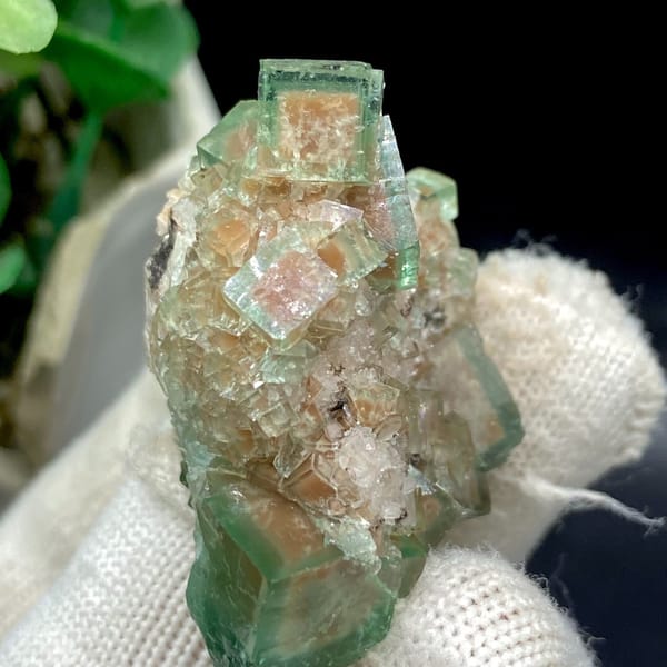 Green cubic fluorite on pale matrix from Hebei — detail view