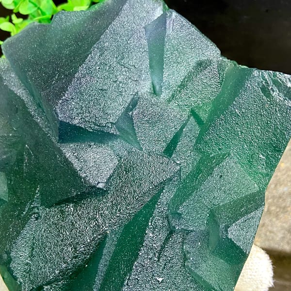 Tower of green fluorite octahedra with purple edges from Zhejiang, China, close-up of the crystal faces