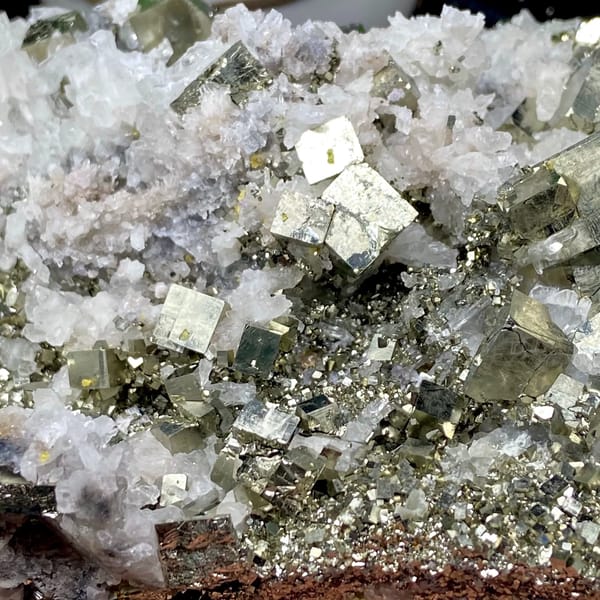 Tall tower of pyrite and white quartz on stand from Shangbao, Hunan, China, close-up of the crystal faces