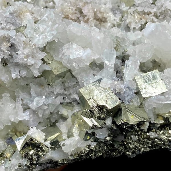 Tall tower of pyrite and white quartz on stand from Shangbao, Hunan, China, side view
