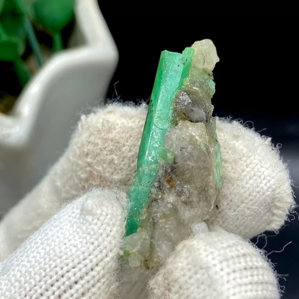 Green emerald beryl crystal on pale matrix from Yunnan — detail view