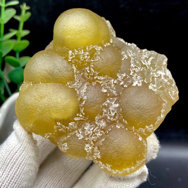 Yellow botryoidal fluorite spheres on quartz from Henan — detail view