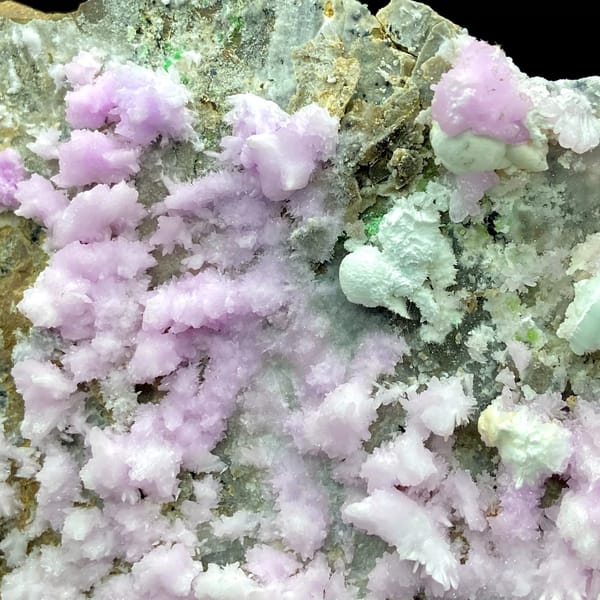 Large plate of pink aragonite crusts on tan rock from Yunnan, China, reverse side