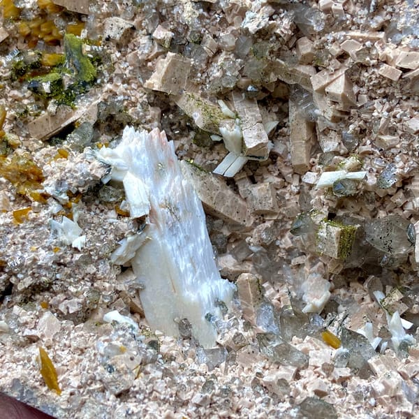 Multi-mineral plate of feldspar, zeolite, quartz, pyrite and epidote on stand from Fujian, China, reverse side