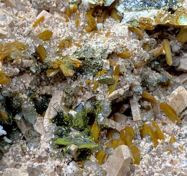 Multi-mineral plate of feldspar, zeolite, quartz, pyrite and epidote on stand from Fujian, China, top view