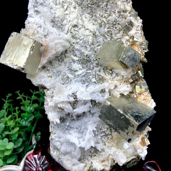 Pyrite and quartz tower on carved stand from Shangbao, Hunan, China, close-up of the crystal faces