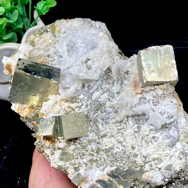 Pyrite and quartz tower on carved stand from Shangbao, Hunan, China, detail of the matrix contact