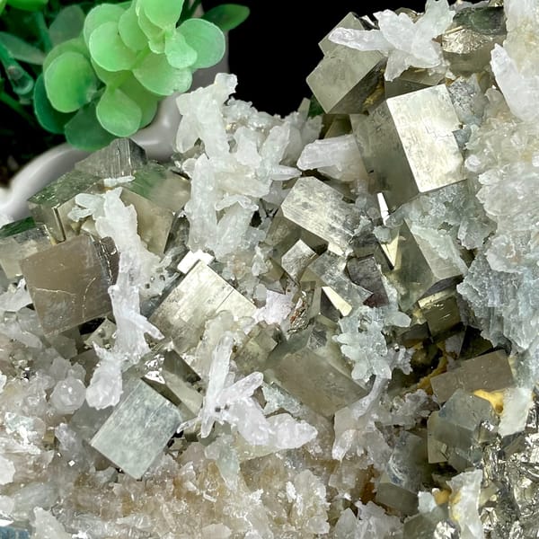 Large cluster of pyrite cubes and white quartz from Hunan, China, detail of the matrix contact